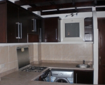 Dark Kitchen with beige marble in Makadi