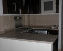 Dark Kitchen with beige marble in Makadi