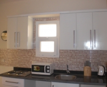 Tiba Kitchen in White with black marble